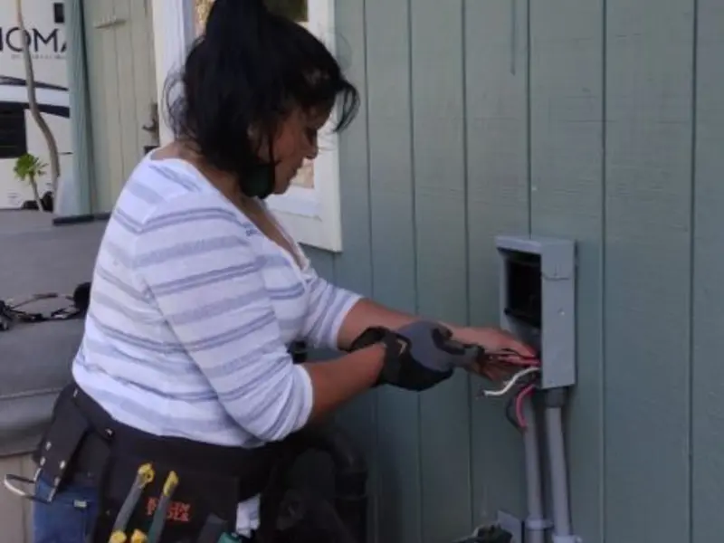 Licensed electrician wiring an exterior subpanel in Bonanza