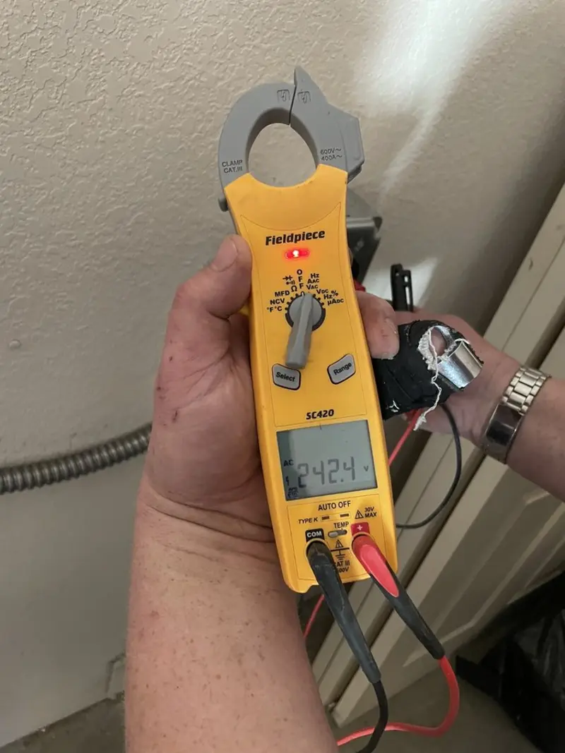 Voltage testing with clamp meter during Recessed Lighting Installation in Bonanza